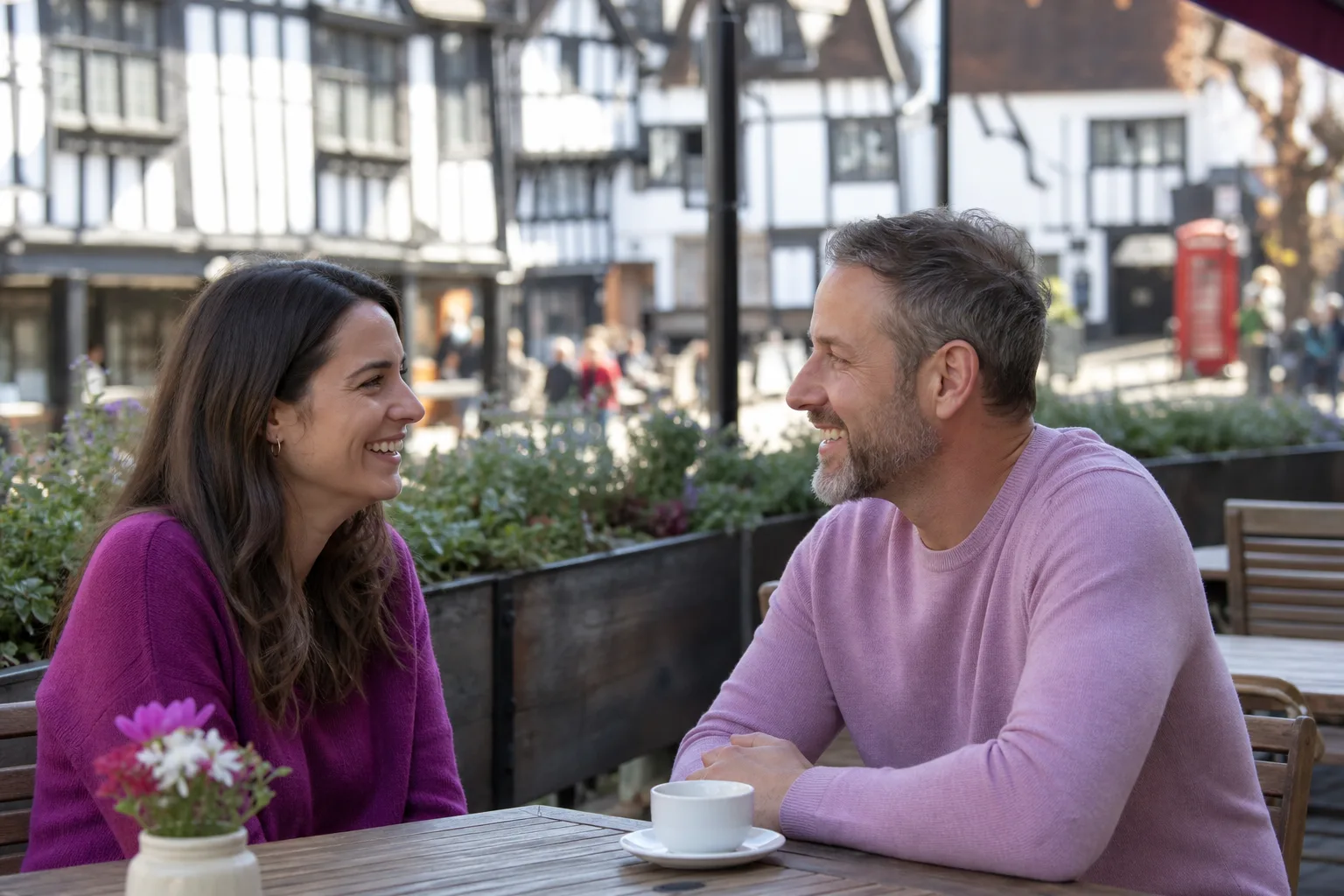 Two people talking over coffee in a Shropshire market town